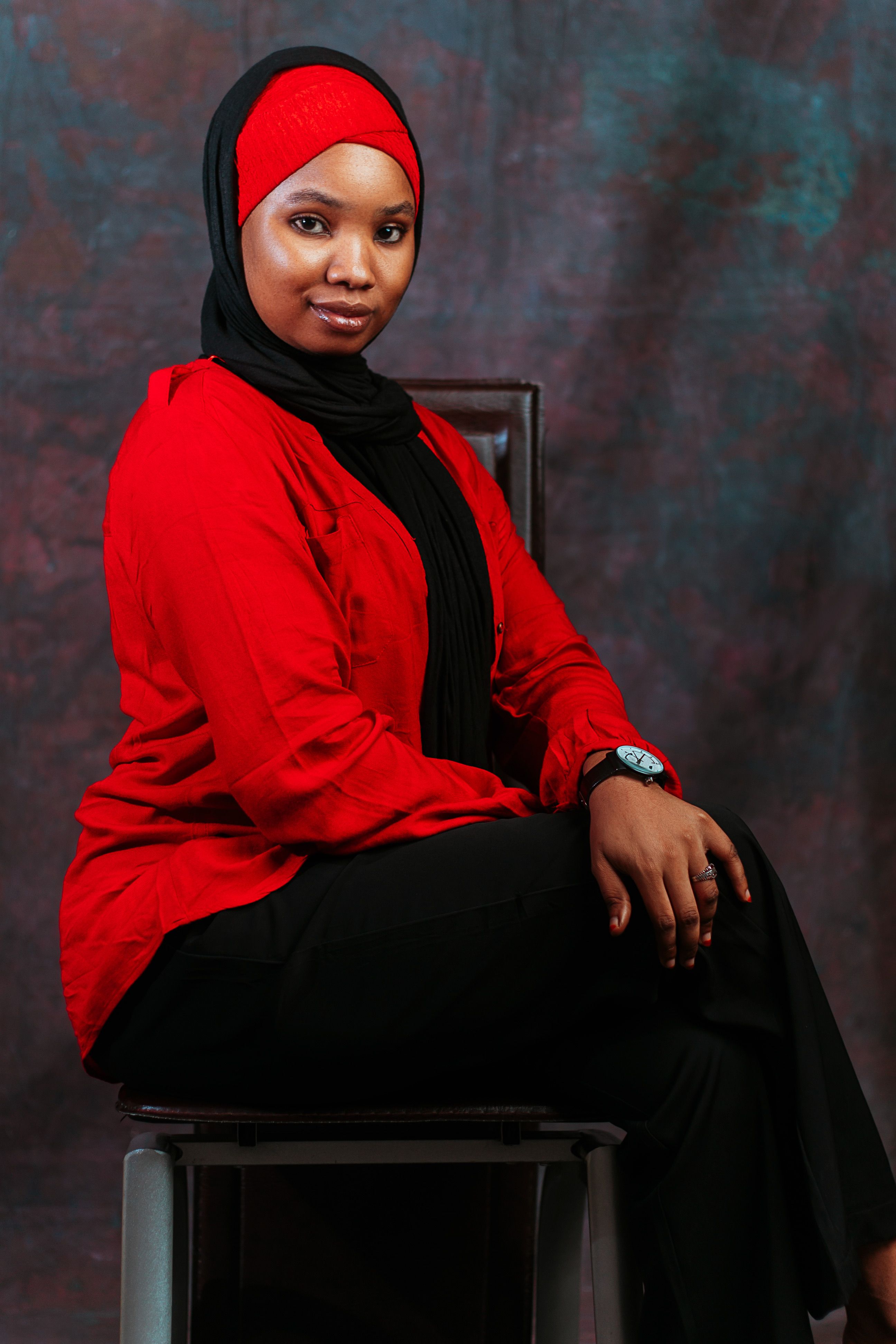 Portrait of Confident Woman in Red and Black Attire · Free Stock Photo