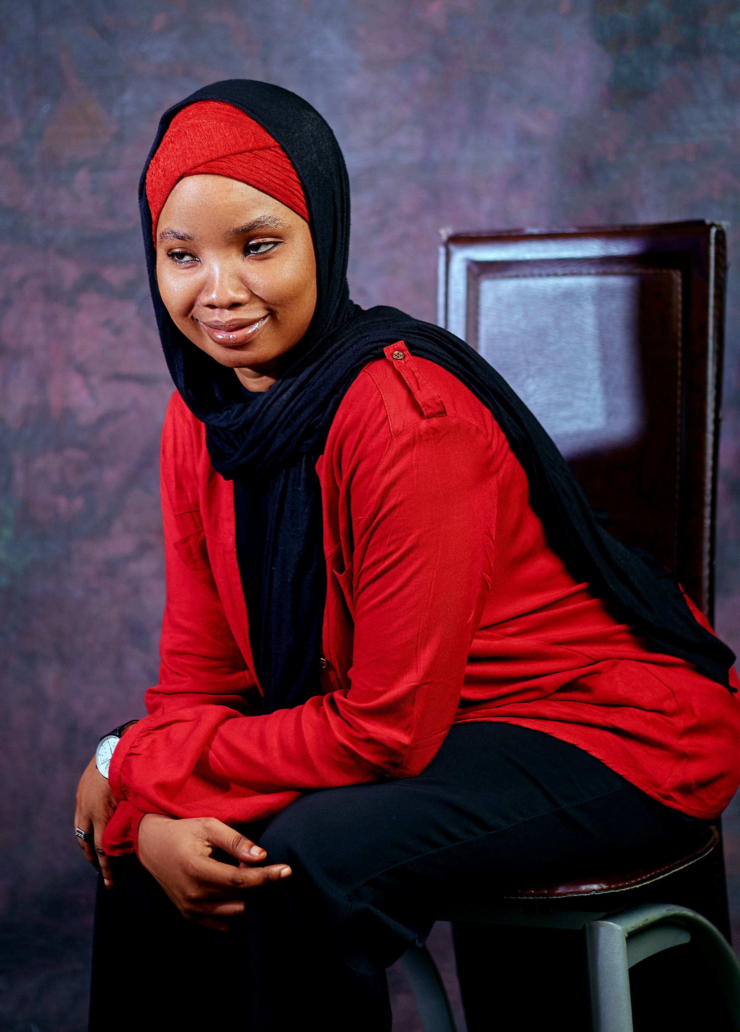 Confident Woman in Red and Black Hijab Portrait · Free Stock Photo