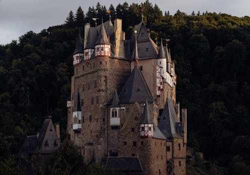 Discover the enchanting medieval Burg Eltz castle surrounded by dense forests in Germany.