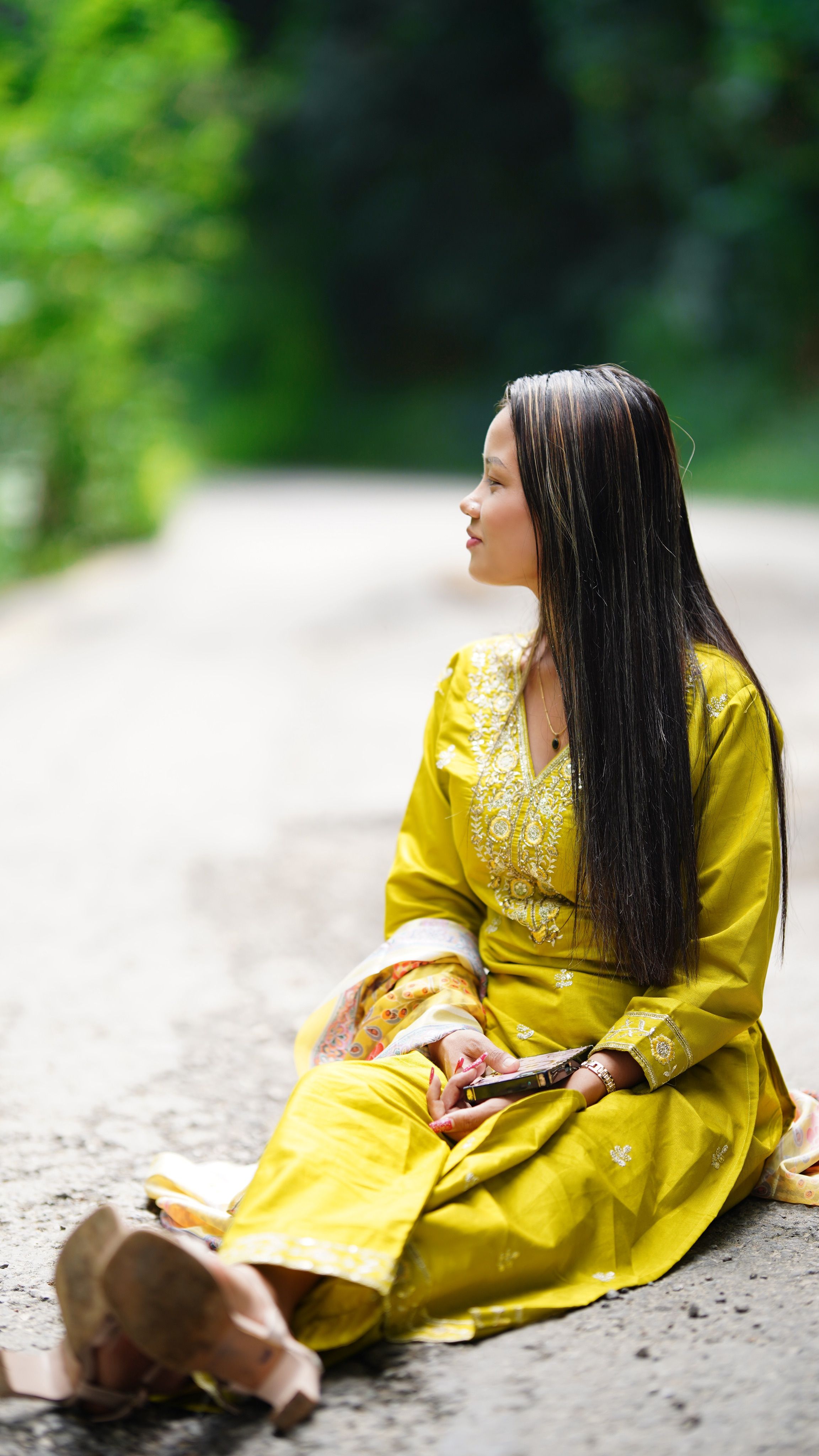 Woman Sitting on Road Wearing Yellow Traditional Dress · Free Stock Photo