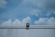 Industrial Rooftop with Blue Sky and Building Light