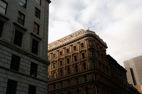 Free A captivating view of historic architecture in downtown Montreal under a cloudy sky. Stock Photo
