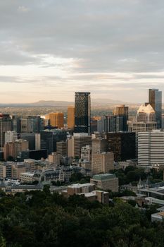 Captivating view of downtown Montreal skyline under a sunset sky, showcasing urban architecture.