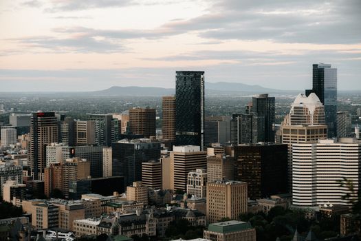 Aerial perspective of Montréal's skyline showcasing modern architecture against a serene evening sky.