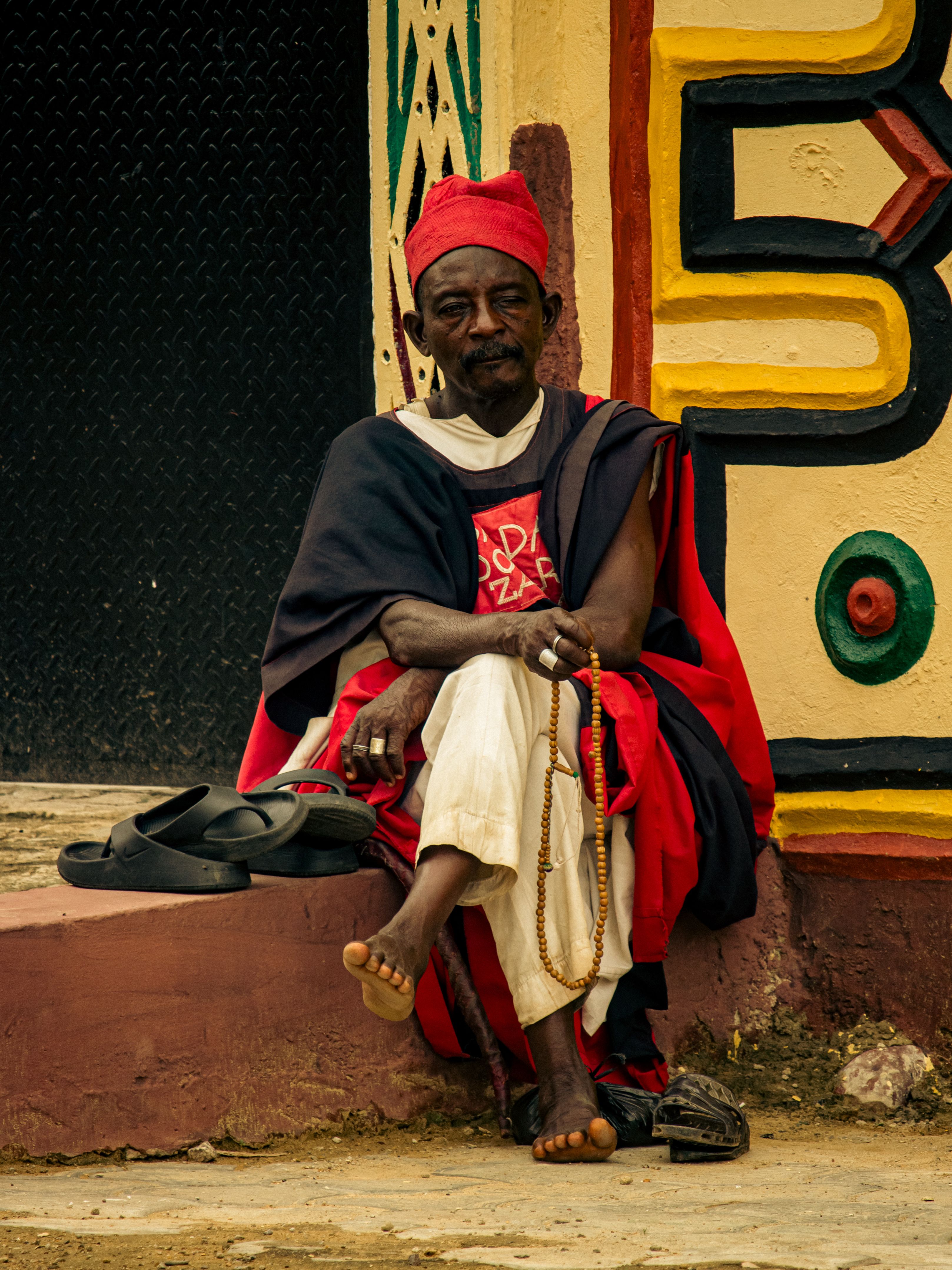 Elder Holding Prayer Beads in Traditional Attire · Free Stock Photo