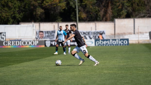 Intense soccer game action with players in motion under daylight.
