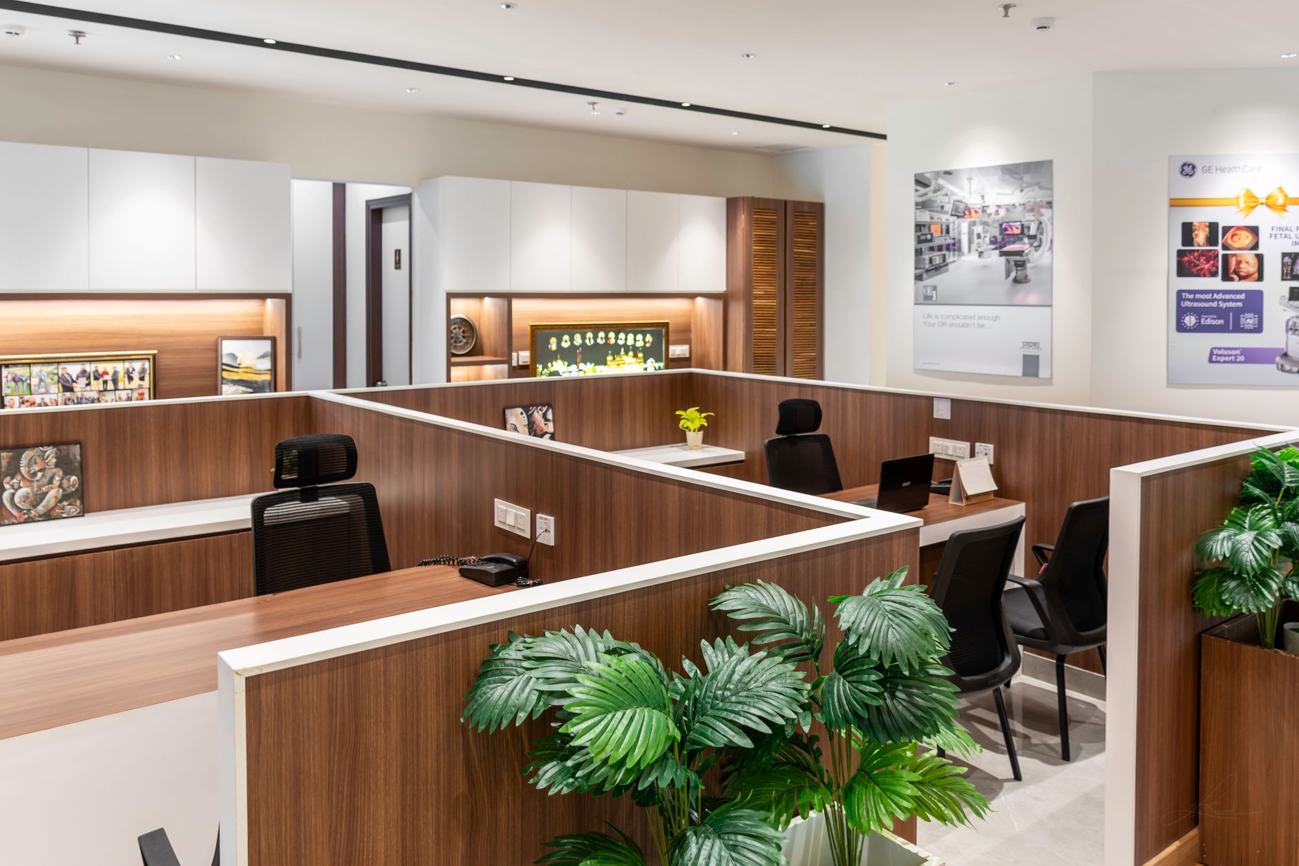Spacious modern office interior with sleek workstations and decor.