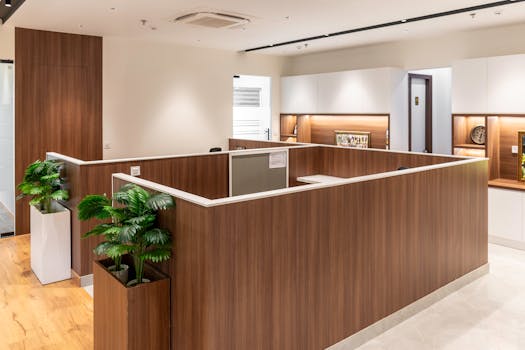 Bright and stylish modern office interior featuring wooden partitions and elegant decor.