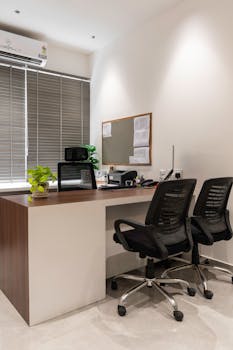 A contemporary office space with sleek furniture, perfect for business meetings.