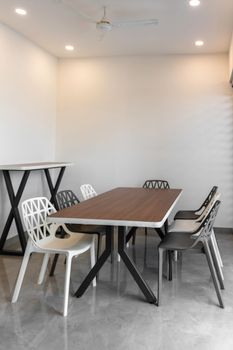 Elegant and modern meeting room with minimalist furniture and neutral tones.