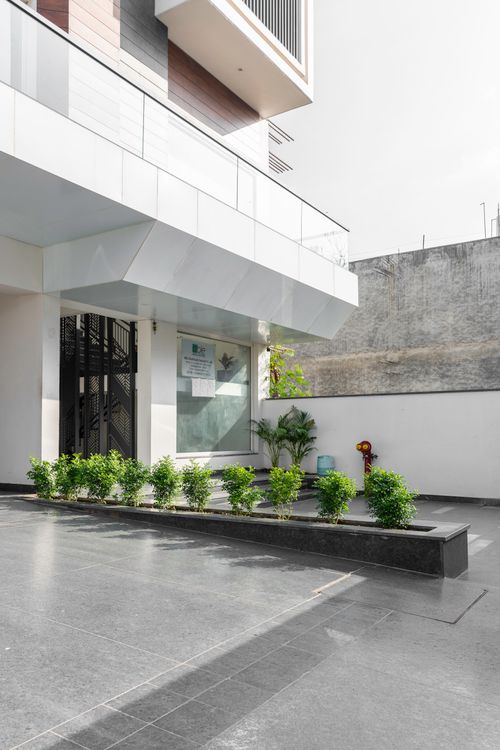 Free Contemporary building entrance with clean design in India. Stock Photo