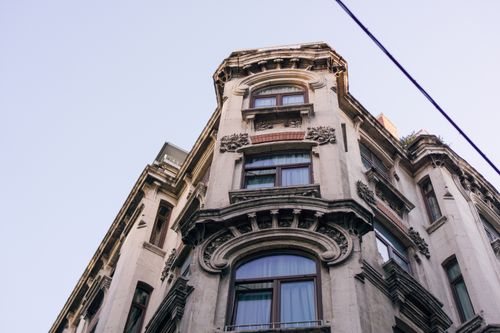 Free A close-up view of a historic European-style building facade in Istanbul under a clear blue sky. Stock Photo
