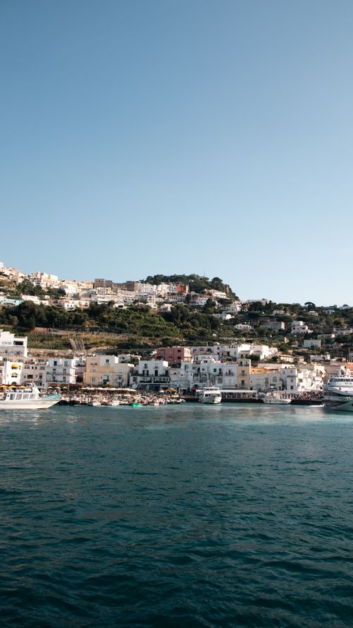 Free Stunning coastal view of Capri, showcasing charming architecture and vibrant sea. Stock Photo