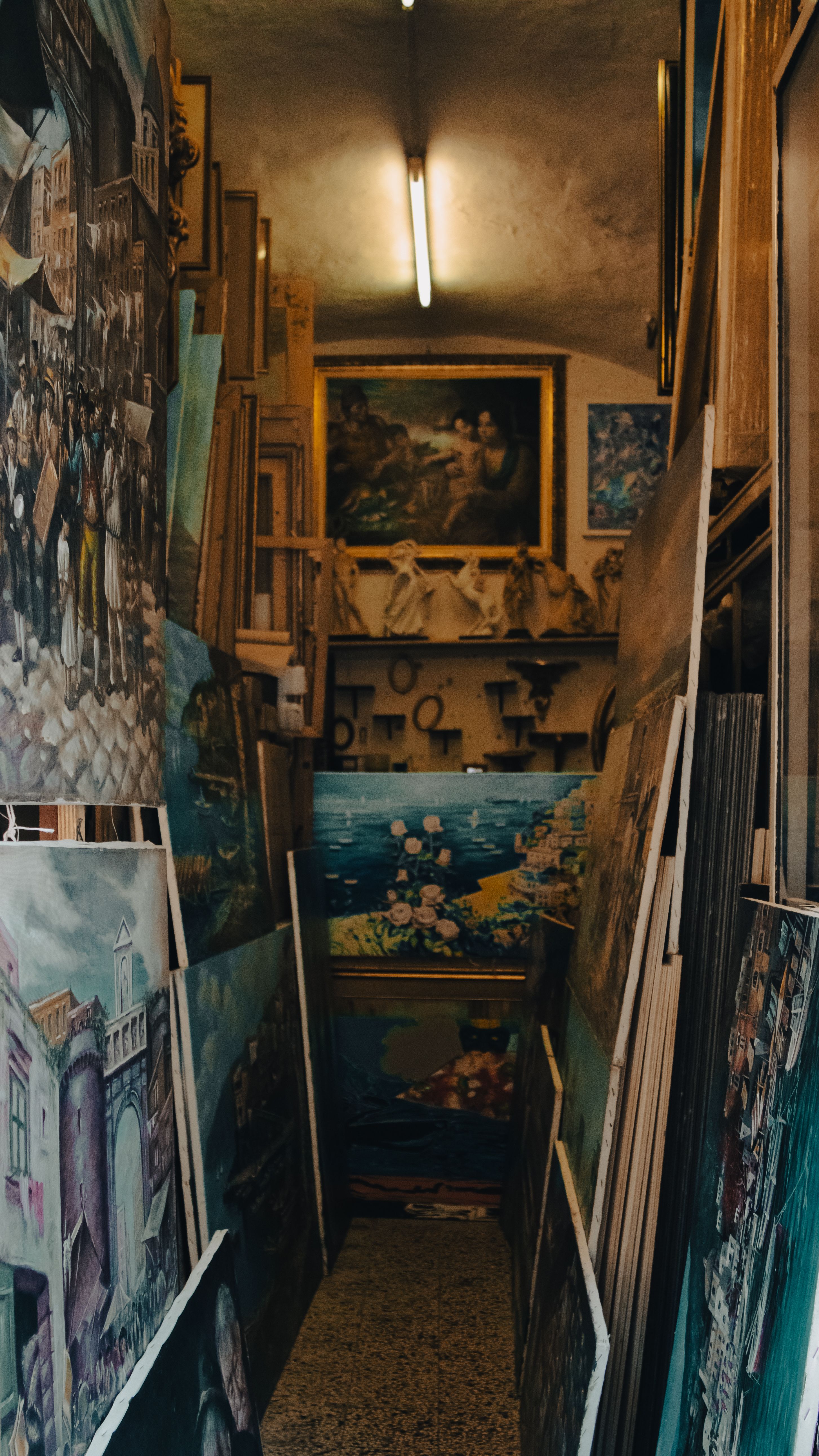 Explore a quaint art gallery in Sorrento, filled with vibrant paintings and classic decor.