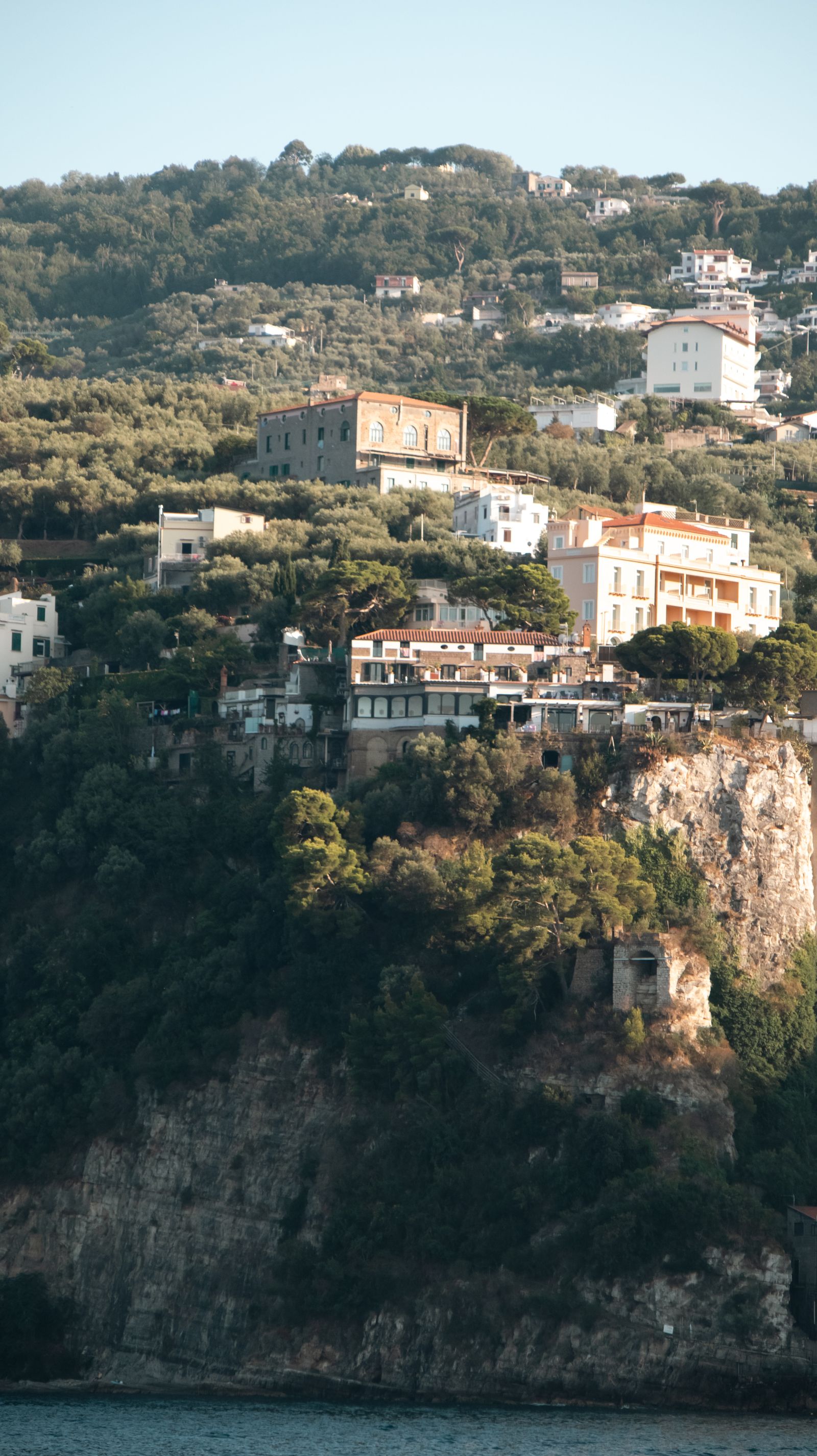 Cliffside buildings of Sorrento overlooking the Bay of Naples and deep blue water