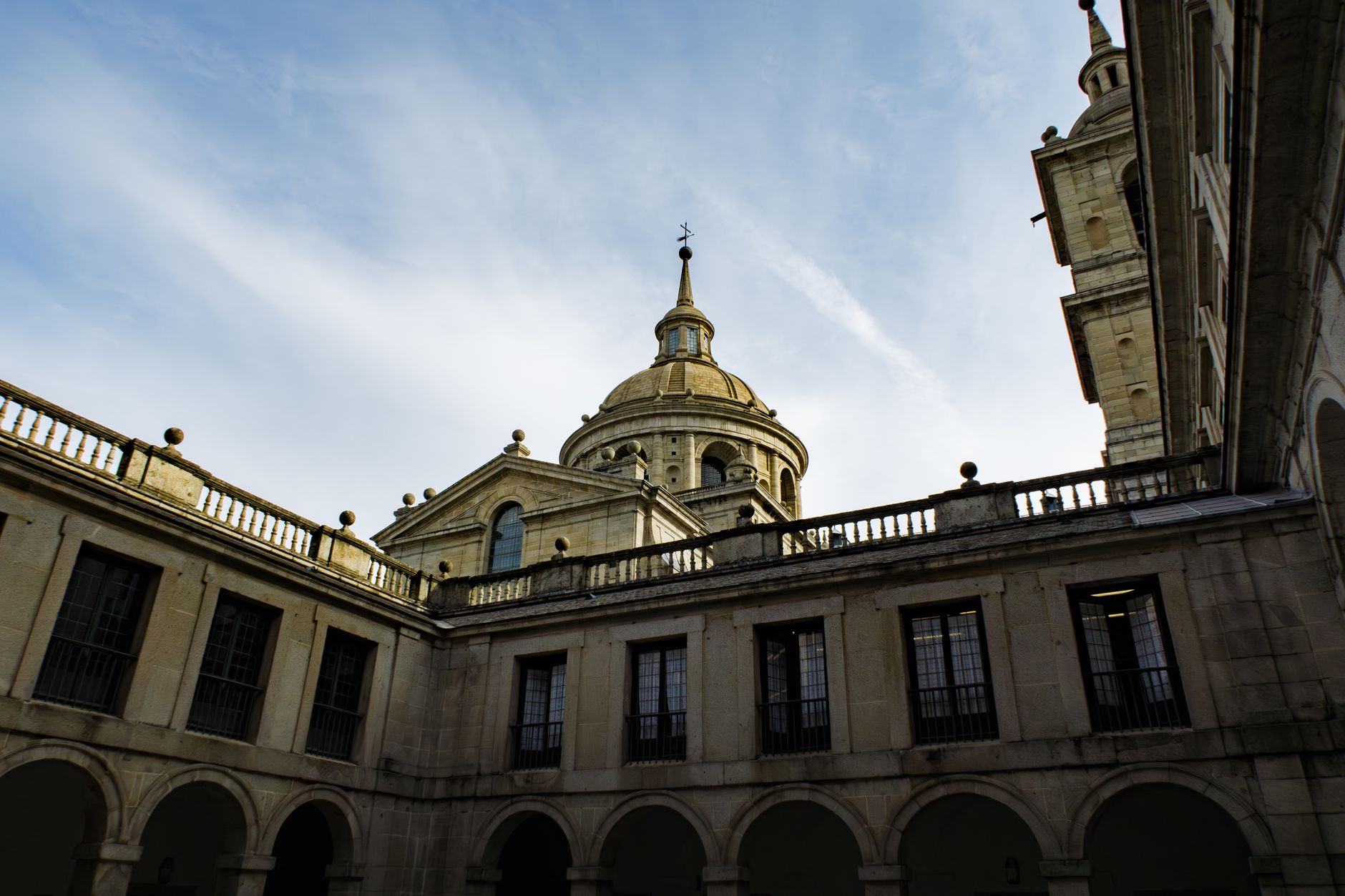 Patio de los Reyes courtyard at El Escorial with granite colonnades and open sky