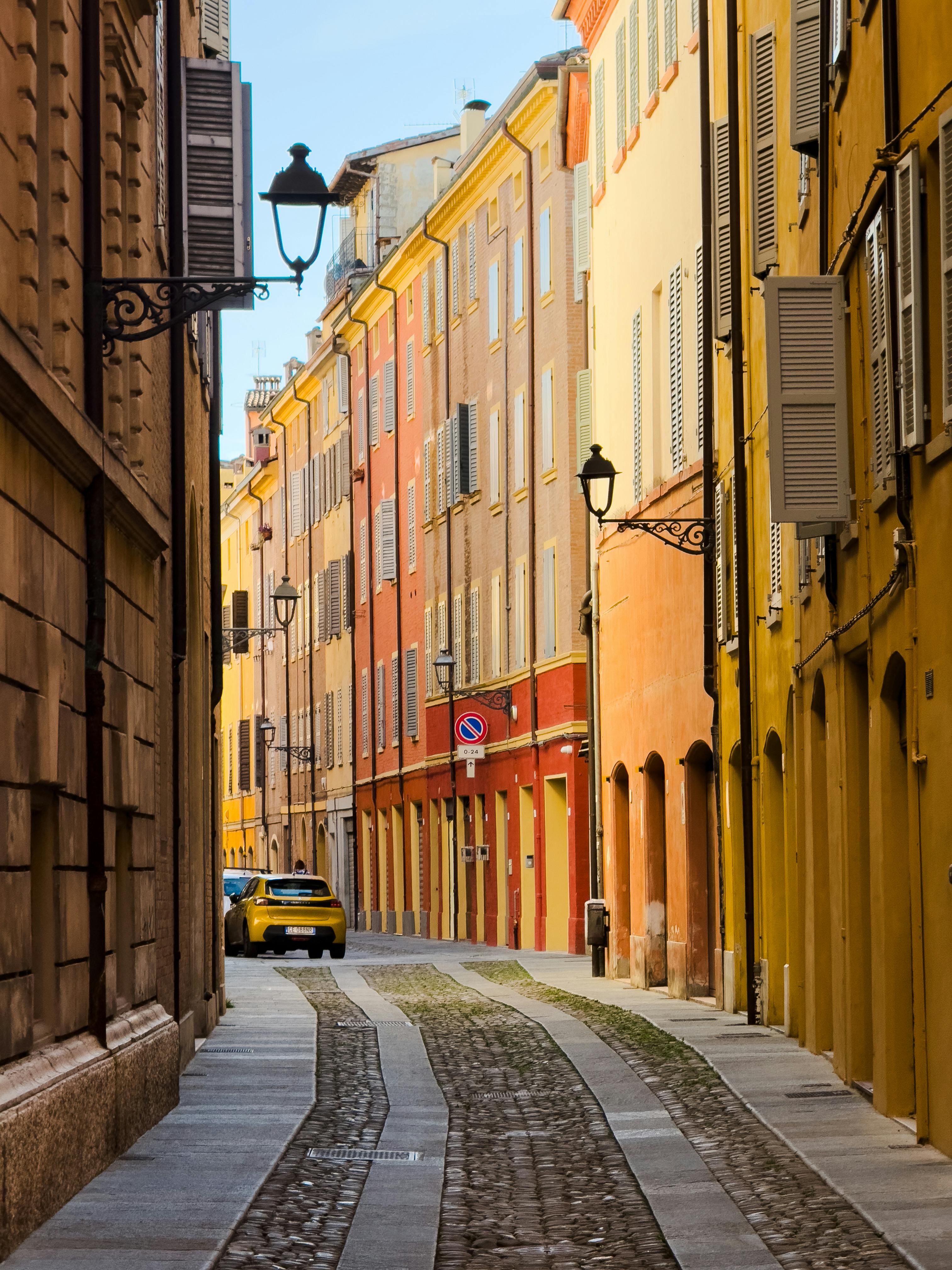 A picturesque street in Italy featuring vibrant facades and classic architecture.