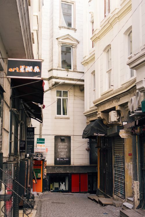 Free Explore the quaint alleyway in Istanbul lined with shops and historic architecture. Stock Photo