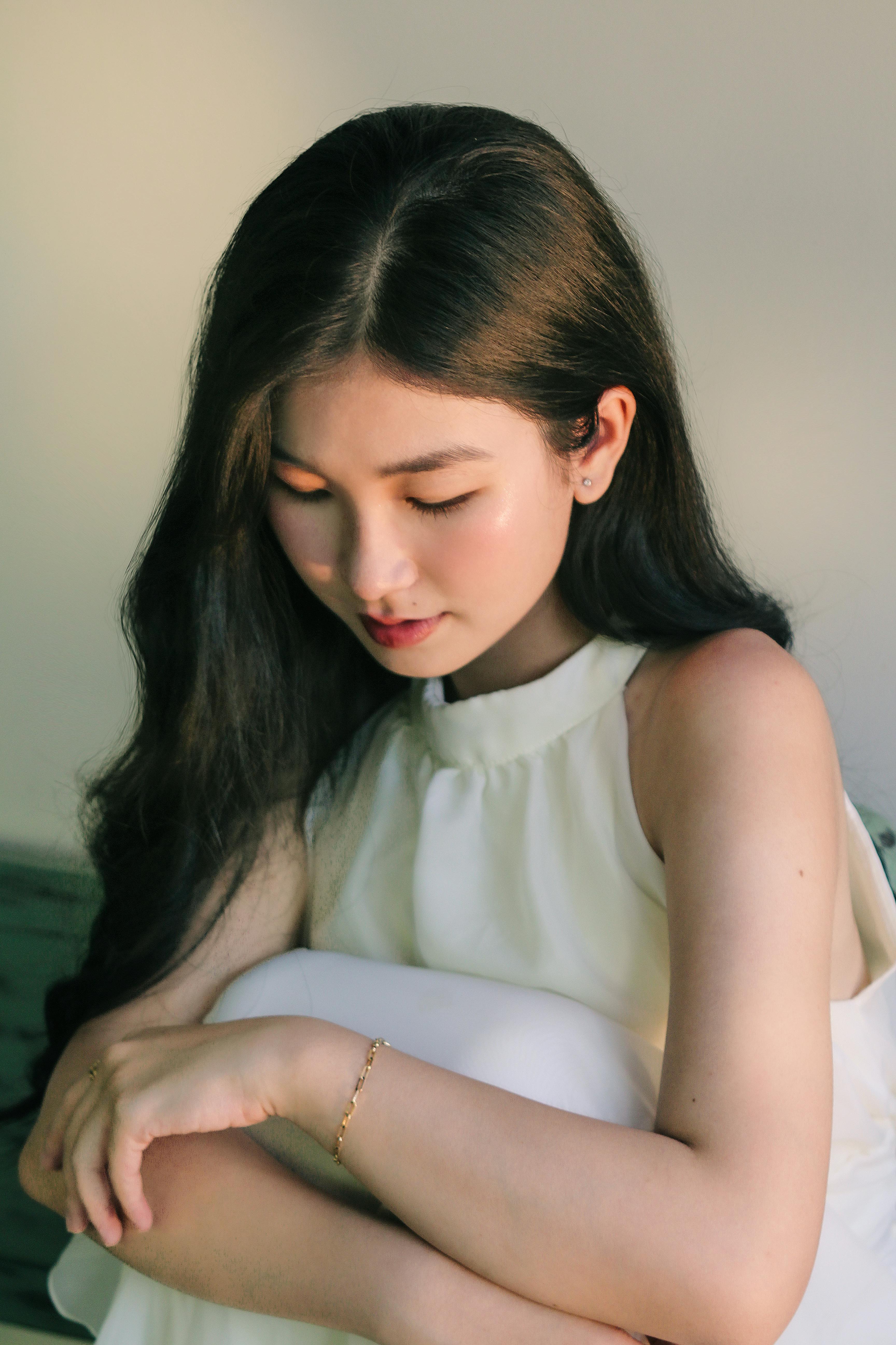 Elegant portrait of a woman in calm and soft lighting, embodying peace and tranquility.