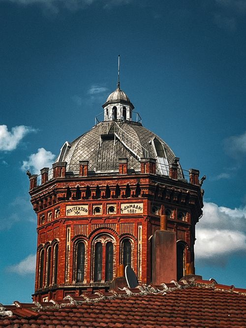 Free View of the iconic Fener Greek High School's dome with vibrant red brick facade in Istanbul. Stock Photo