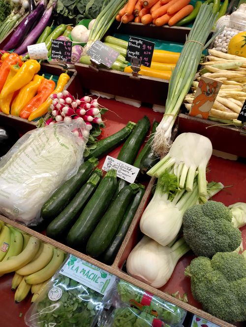 Free A vibrant display of fresh vegetables at a Paris market stall showcasing diverse produce. Stock Photo