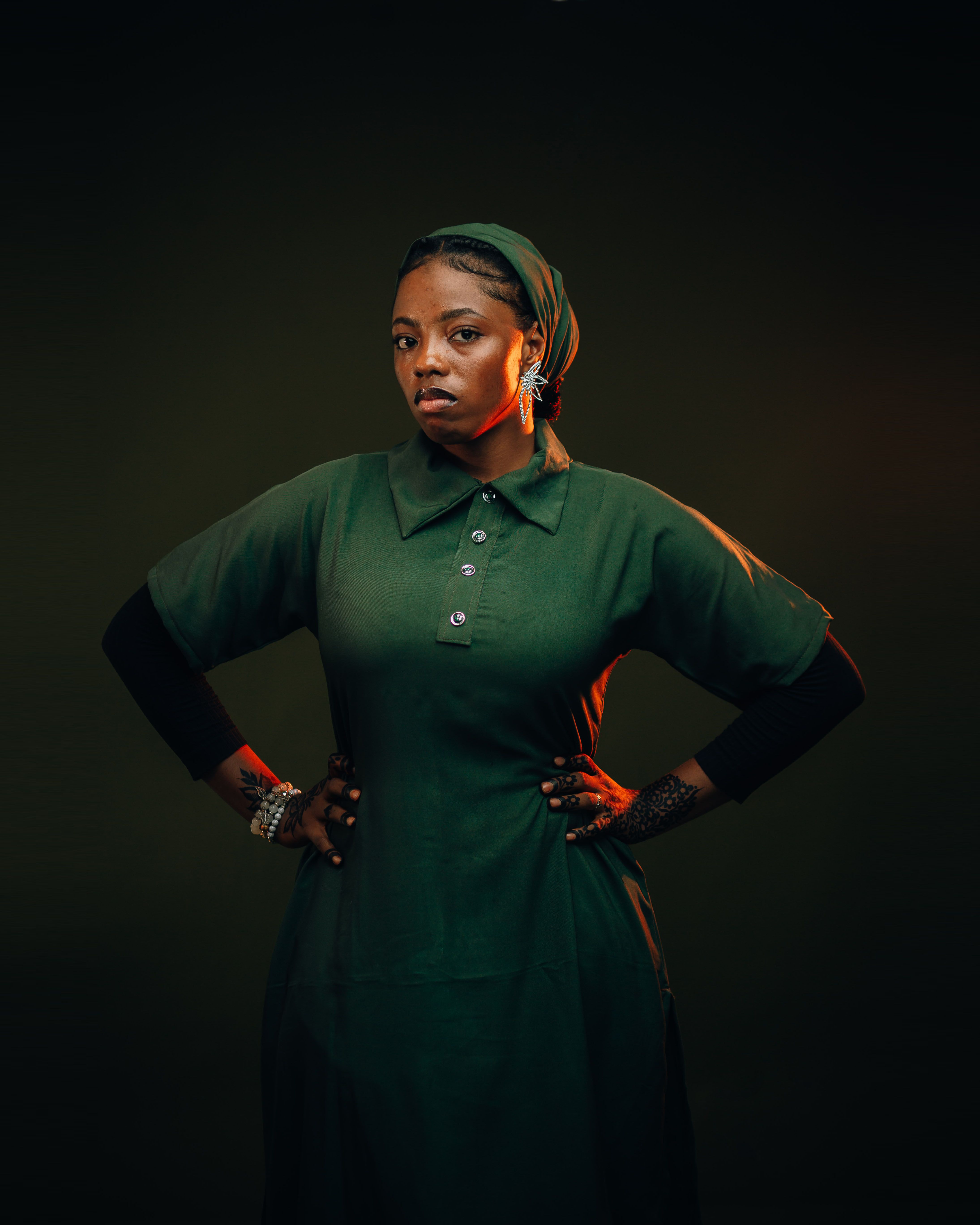 Portrait of a Confident Nigerian Woman in Green Dress  Free Stock Photo