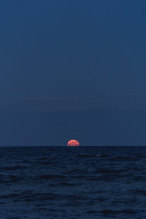 Free Stunning moonrise over the ocean in Akumal, Quintana Roo, México, captured during the night. Stock Photo