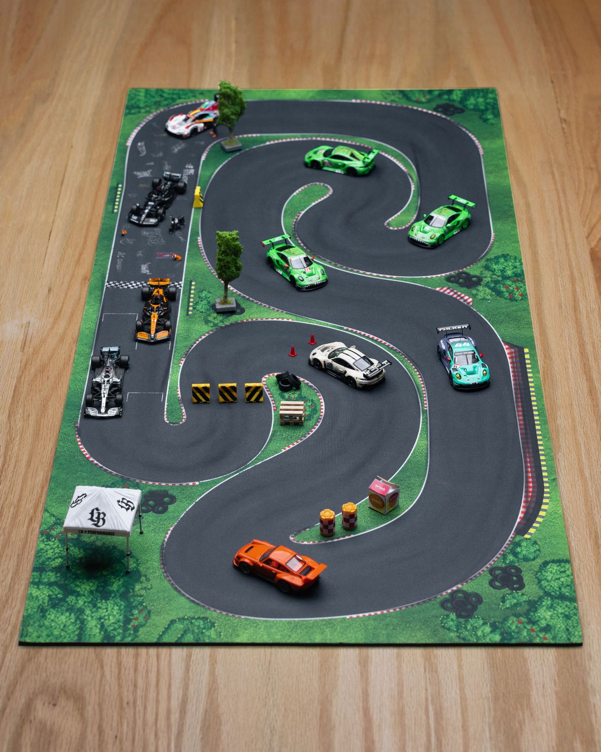 Miniature Racetrack Railing Miniature Racing Track with Diecast Cars · Free Stock Photo