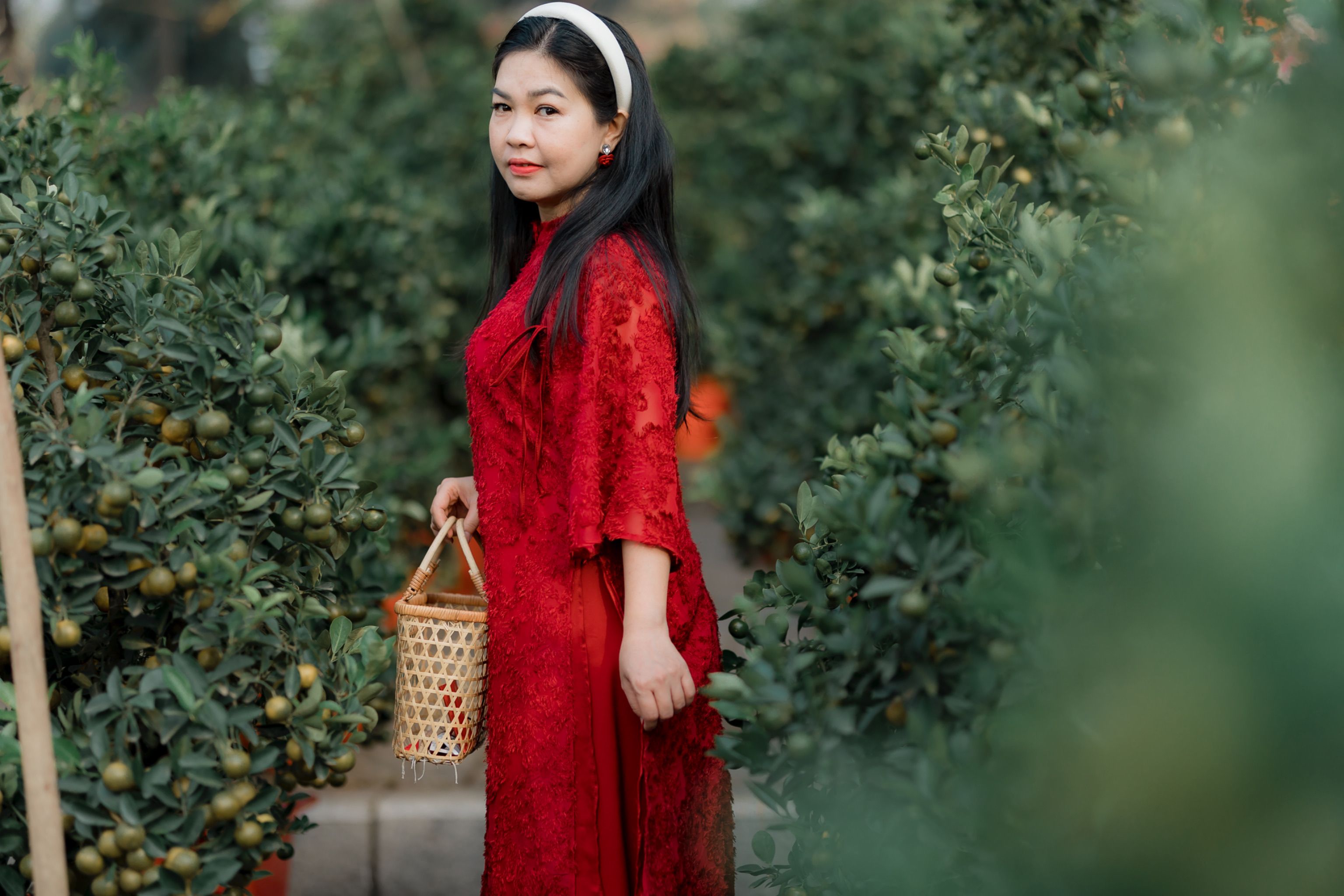 Woman in Red Dress Holding Basket in Orchard · Free Stock Photo