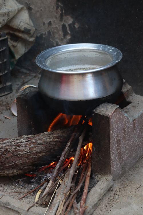 Traditional Cooking with Fire and Metal Pot · Free Stock Photo