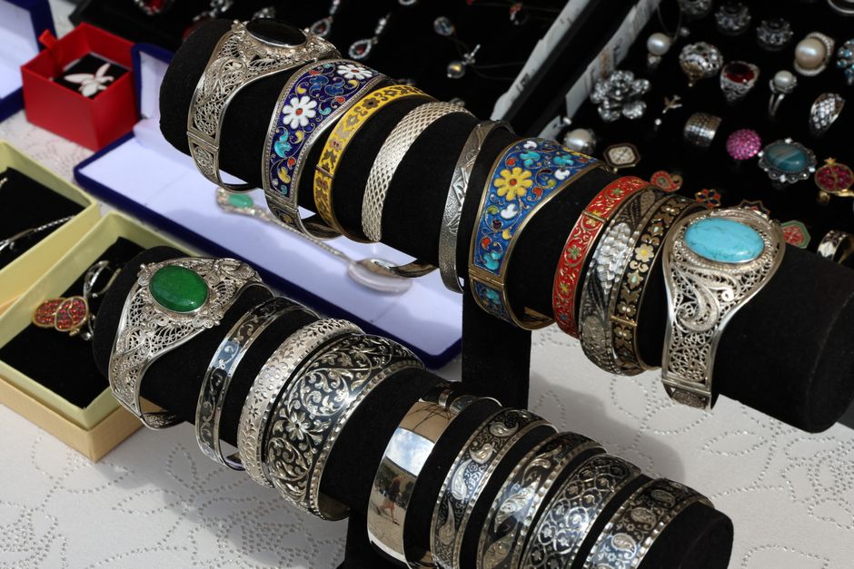 Display of ornate sterling silver bracelets in a jewelry shop