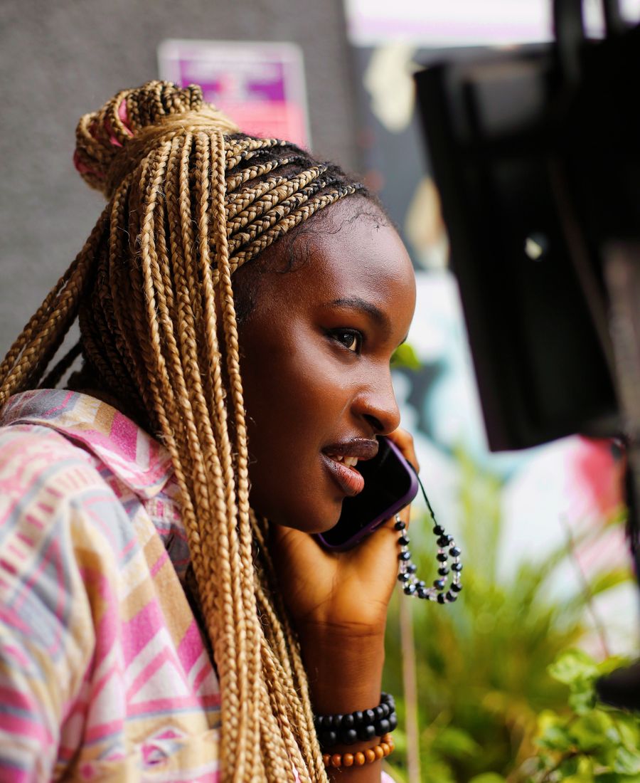 A smiling woman on a phone call