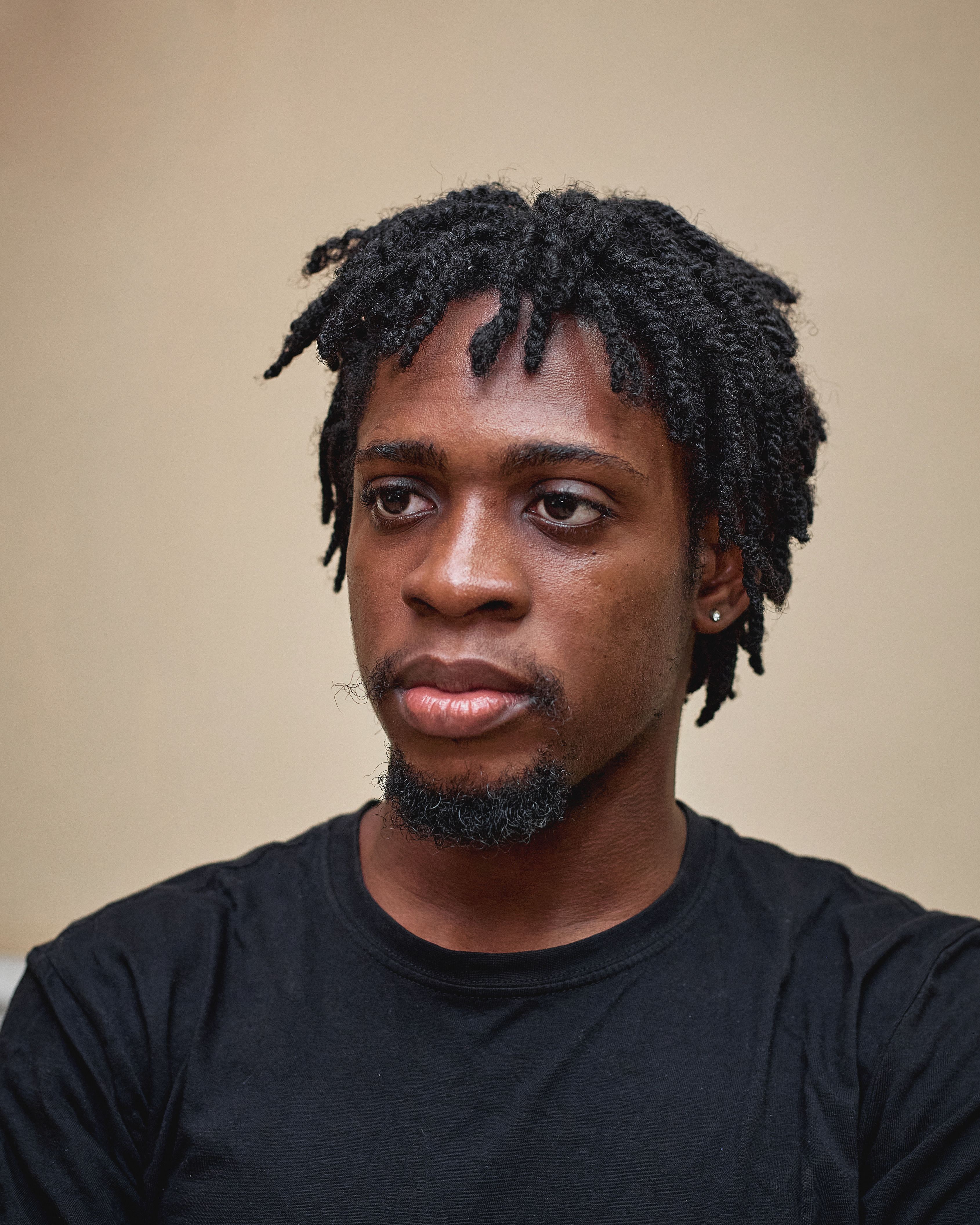 Portrait of Thoughtful Young Man with Dreadlocks · Free Stock Photo