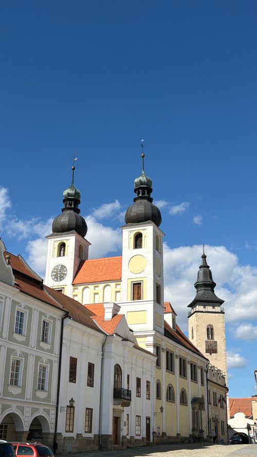 Free Beautiful European church with towers under a clear blue sky, showcasing historical architecture. Stock Photo