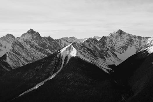 A striking black and white landscape of the Rocky Mountains in Banff, Canada.