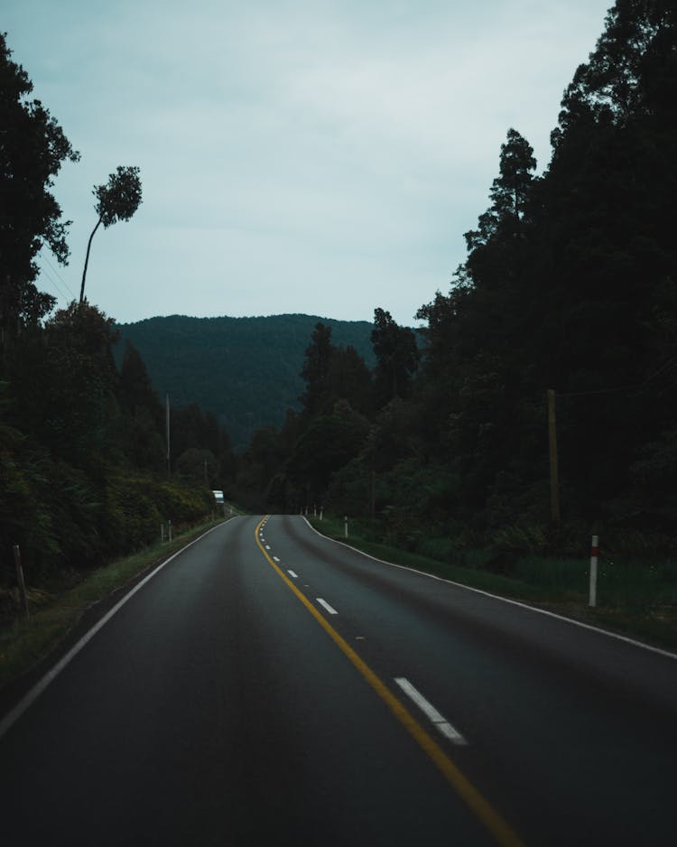 Asphalt Road Leading To A Mountain