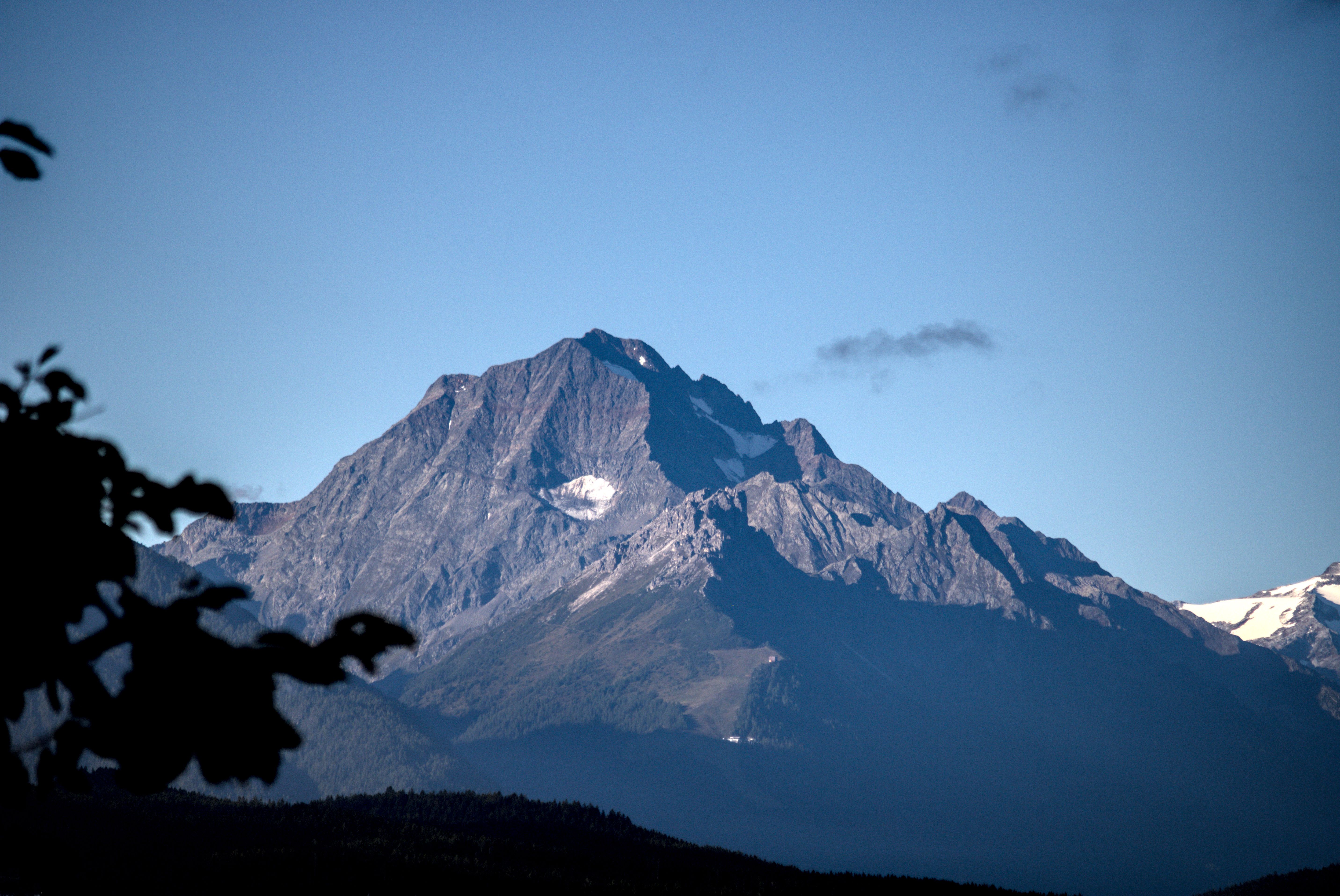 Majestic Mountain Peak in Clear Blue Sky · Free Stock Photo