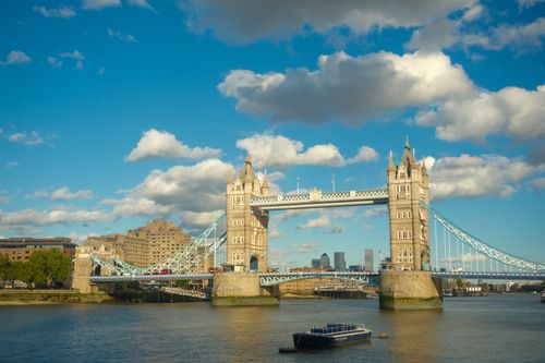 Free Breathtaking view of Tower Bridge, London, under a sunny blue sky with clouds. Stock Photo
