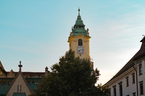 Free Stunning view of the historic clock tower in Bratislava, captured at sunset with clear skies. Stock Photo