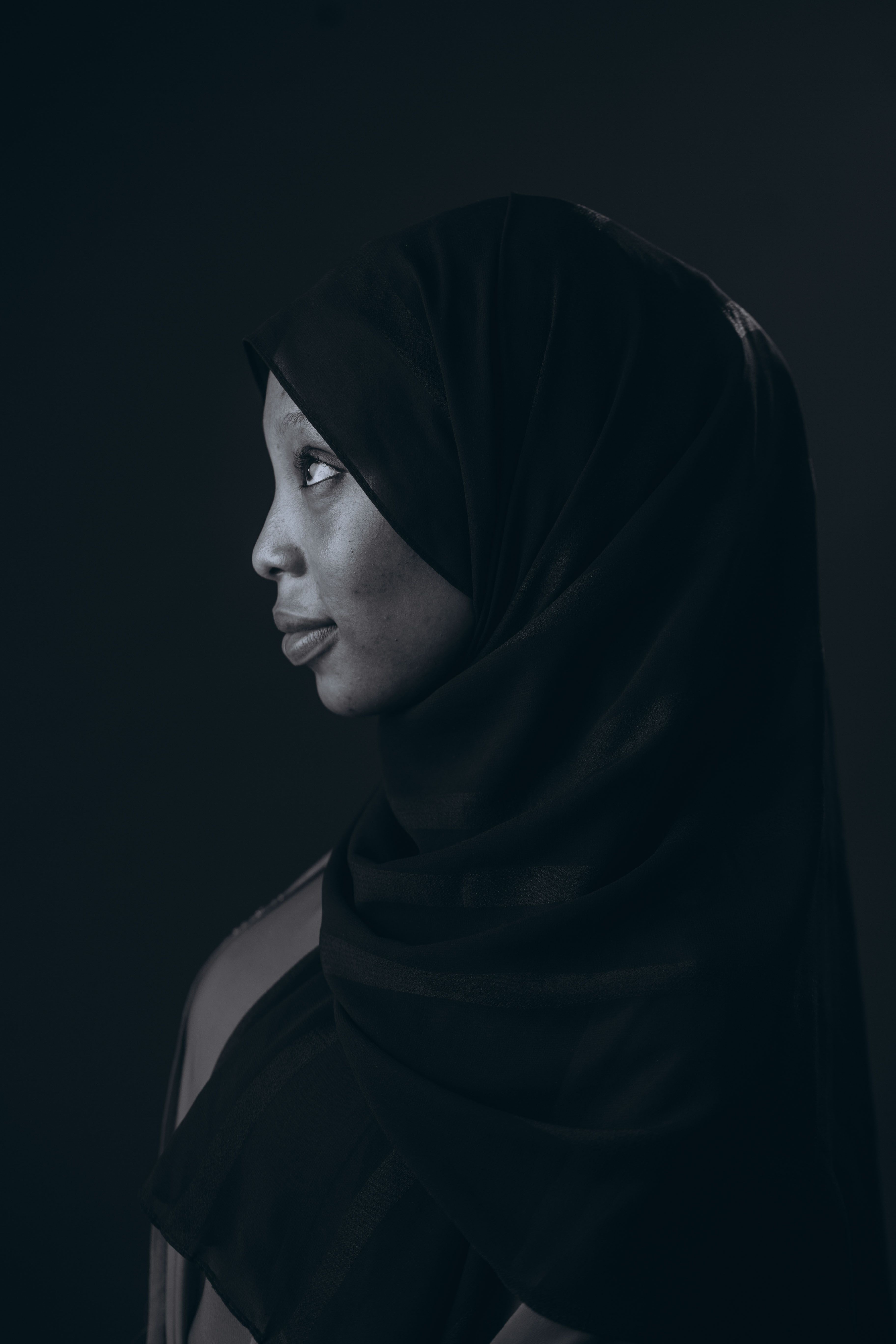 Portrait of a Woman in Black Hijab in Low Key Lighting · Free Stock Photo