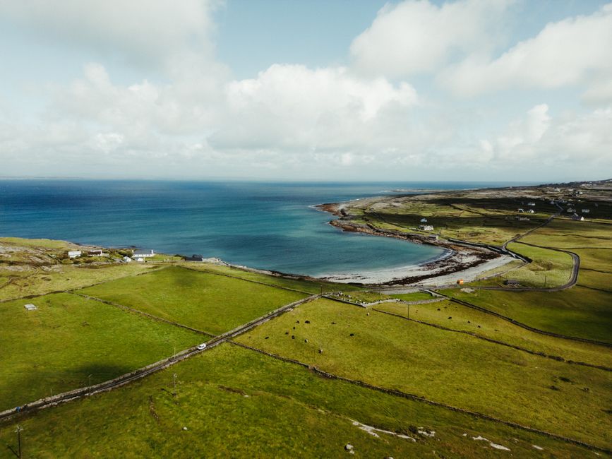 Stunning aerial shot of County Clare Stunning aerial shot of County Clare's coastline with lush green fields meeting the Atlantic Ocean.
