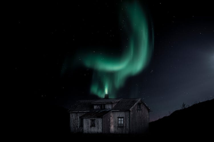 Brown Wooden House During Night Time