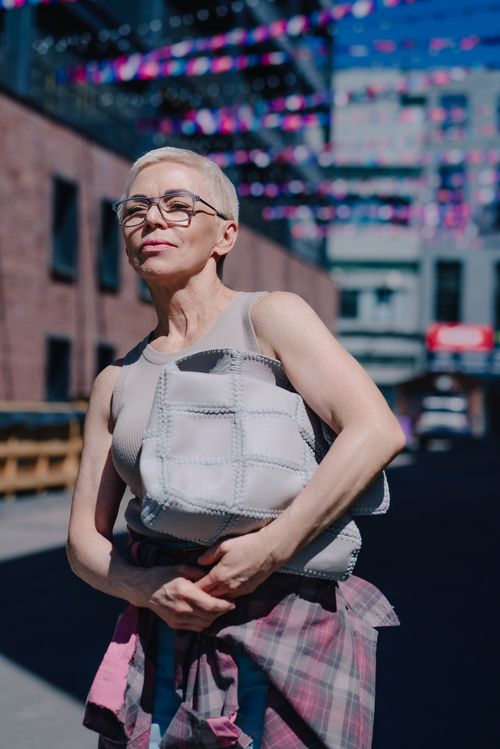 Free Stylish senior woman in urban environment, exuding confidence and grace. Stock Photo