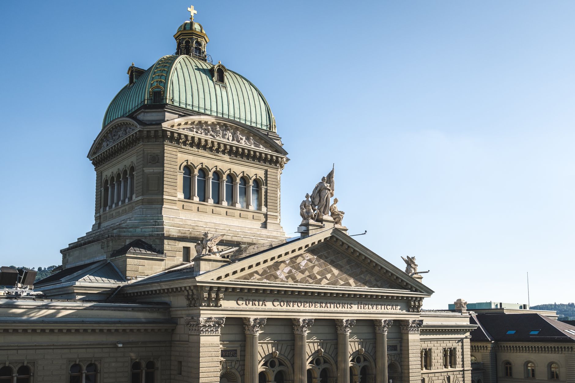 Exterior view of the Swiss Federal Palace in Bern, Switzerland, under clear skies.