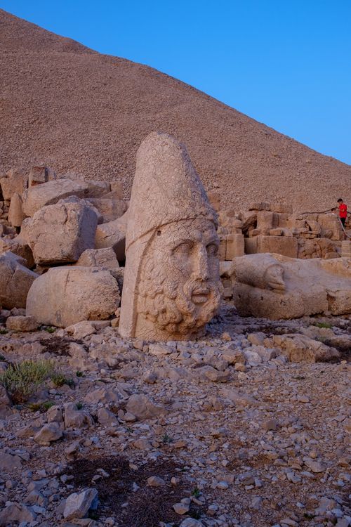 Free Explore the ancient stone statues at Mount Nemrut with a vibrant blue sky backdrop. Stock Photo