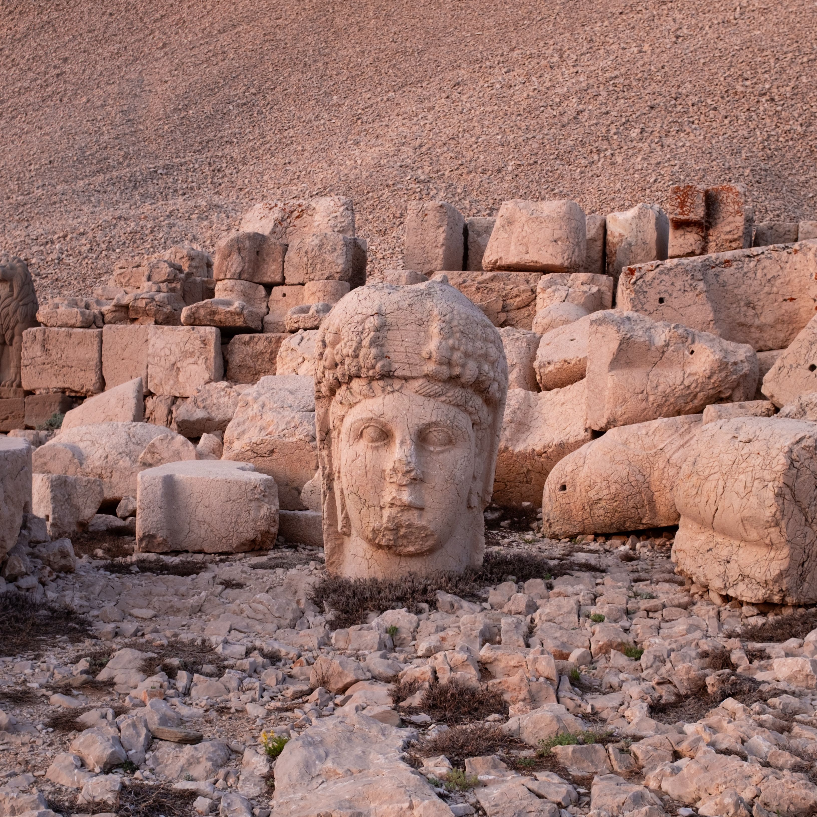 A detailed view of a colossal stone head at Mount Nemrut, Turkey's ancient site.