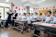 Students Saluting in a Decorated Classroom