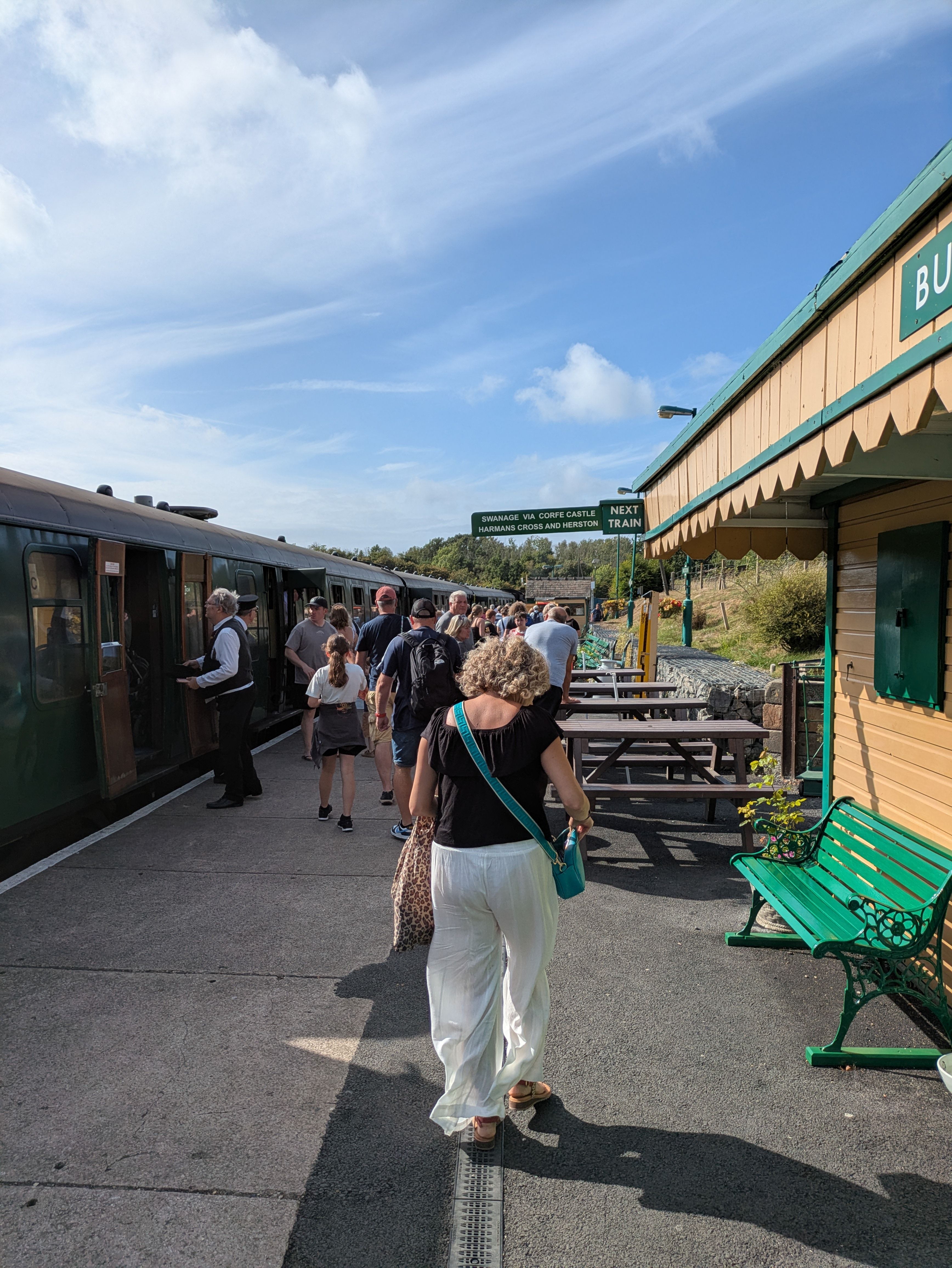 People Boarding Train at Historic Railway Station · Free Stock Photo