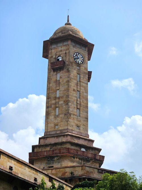 Free Majestic clock tower against blue sky in Ahmedabad, India, showcasing historic architecture. Stock Photo