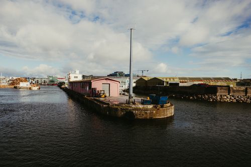 Free Beautiful view of Galway Port showcasing industrial architecture against a cloudy sky. Stock Photo